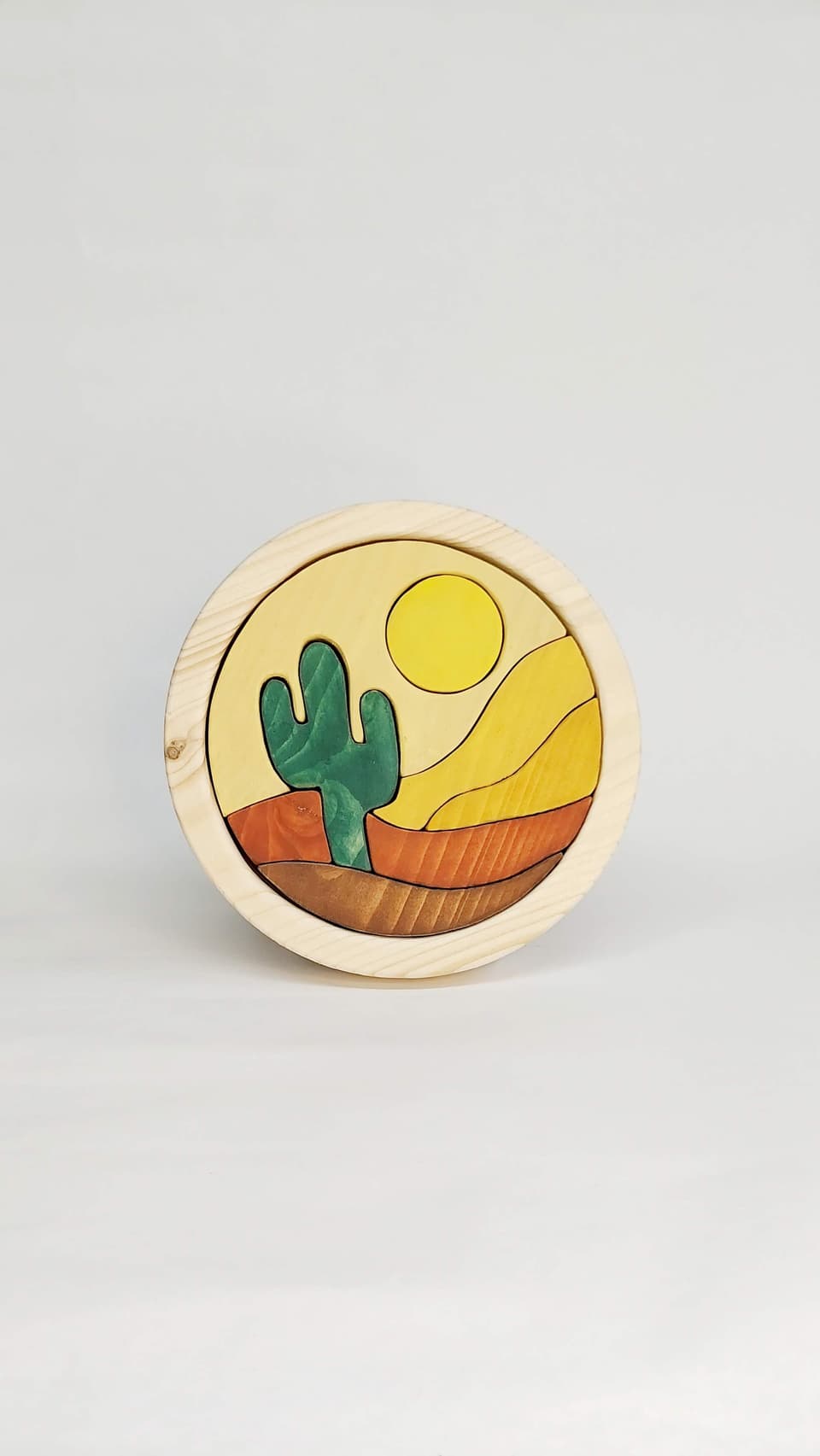 Puzzle de madera redondo con cactus y sol